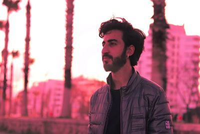 Portrait of young man standing outdoors