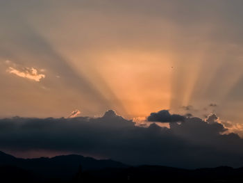 Low angle view of silhouette mountain against sky during sunset