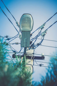 Low angle view of street light against sky
