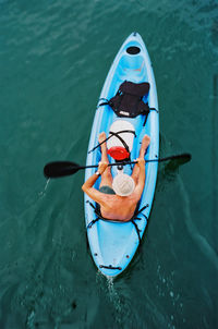 High angle view of man sitting in sea