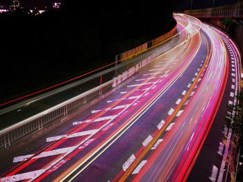 High angle view of light trails on road at night