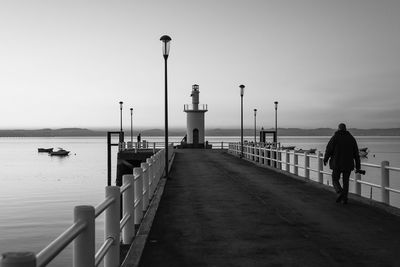 Pier on sea against sky