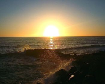 Scenic view of sea at sunset