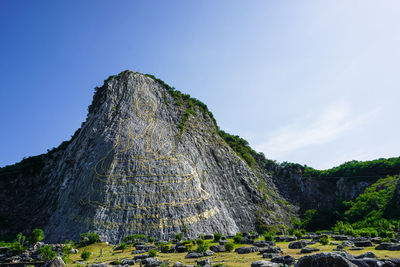 Low angle view of rock formations against sky