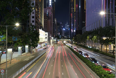 High angle view of light trails on road at night