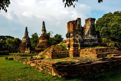 Ruins of temple against cloudy sky