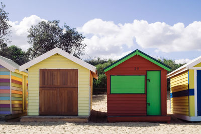 Houses on beach against sky