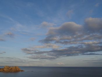 Scenic view of sea against cloudy sky