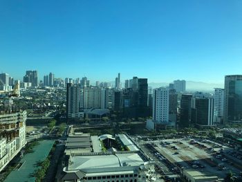 High angle view of cityscape against clear blue sky