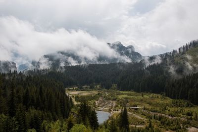 Scenic view of mountains against cloudy sky