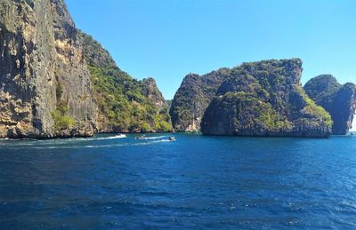 Scenic view of sea against clear blue sky