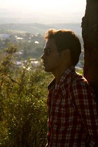 Side view of young man looking away