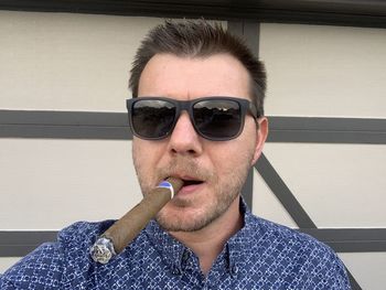 Portrait of man smoking cigarette