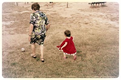 Full length of girl playing on field