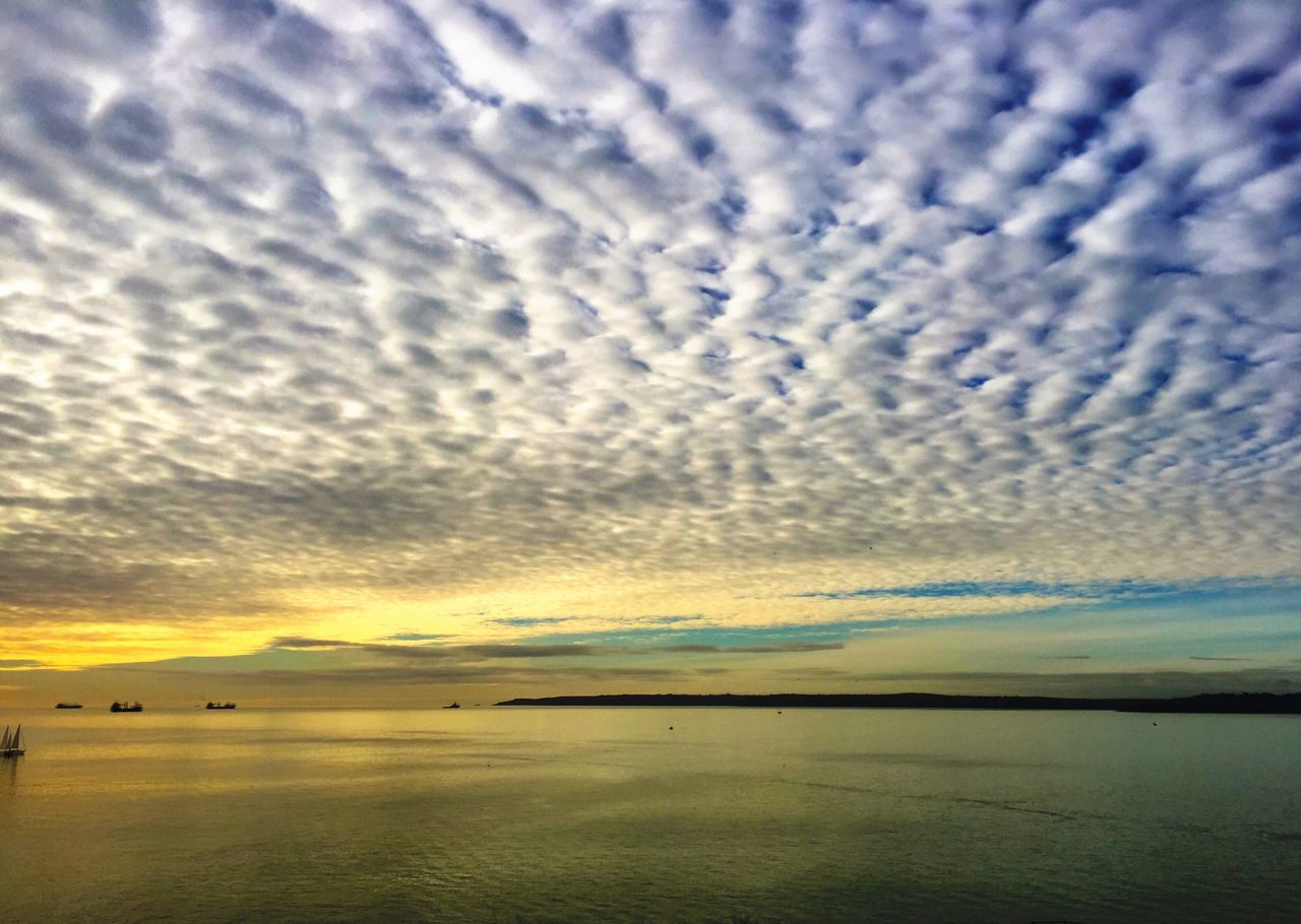 sky, tranquil scene, cloud - sky, sea, scenics, tranquility, water, beauty in nature, cloudy, horizon over water, nature, cloud, beach, sunset, idyllic, weather, dramatic sky, overcast, shore, outdoors