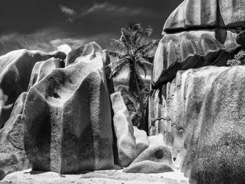 Close-up of rock formation against sky