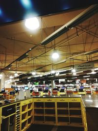 Low angle view of illuminated lights at restaurant