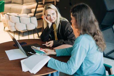 Young woman using laptop at home