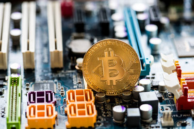 Close-up of bitcoin on circuit board