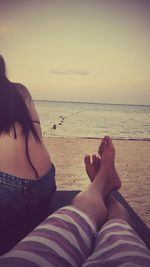 Rear view of people on beach