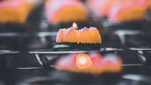 Close-up of lit candles on birthday cake