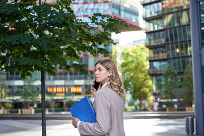 Young woman standing in city