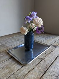 Close-up of purple flowers in vase on table