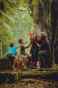 Rear view of old man and kids