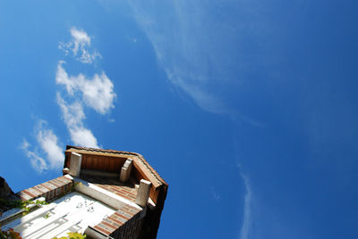 Low angle view of building against blue sky