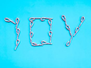 Close-up of love against blue background