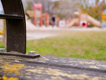 Close-up of metal on table in park