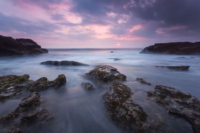 Scenic view of sea against sky during sunset