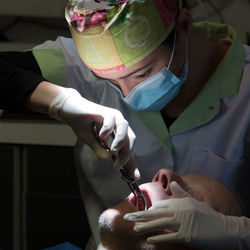 Dentist examining patient