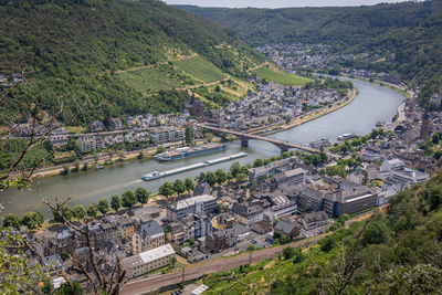 View on the german city of cochem with the colored houses and the cruise and cargo ships
