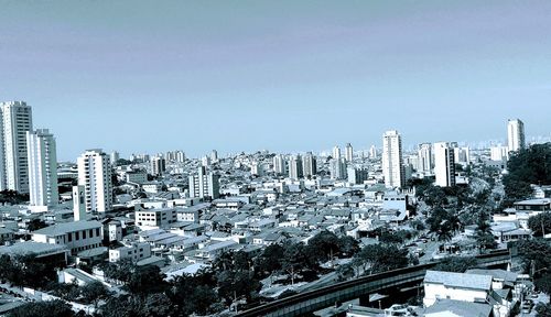 High angle view of buildings against clear sky