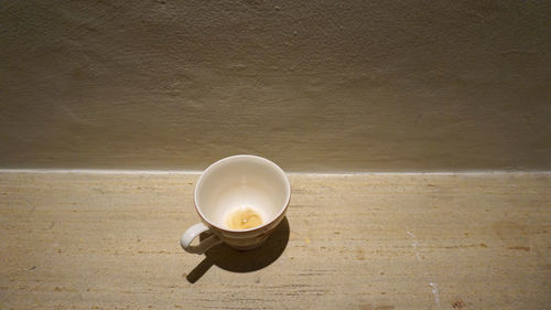 High angle view of coffee cup on table