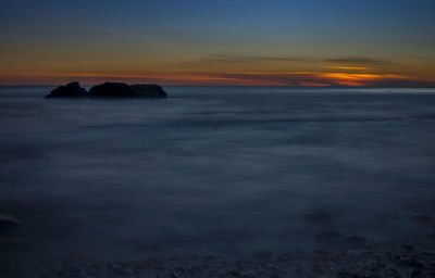 Idyllic shot of sea against sky during sunset