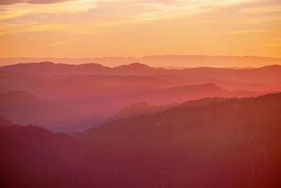 Scenic view of mountains against sky during sunset