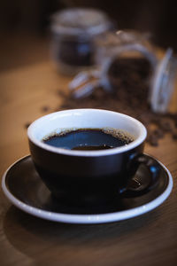 Close-up of coffee cup on table