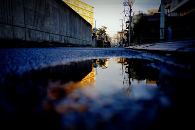 Reflection of buildings in puddle