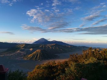 View of volcanic landscape against cloudy sky