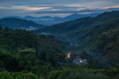 High angle view of trees and mountains against sky