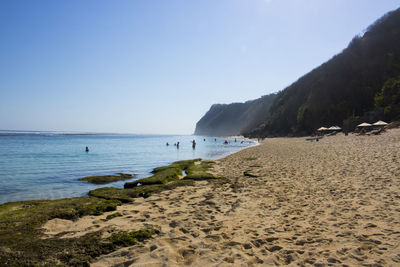 Scenic view of beach against clear sky