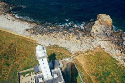 High angle view of buildings by sea