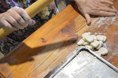 Woman sculpts dumplings at the home