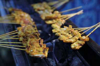 Close-up of meat on barbecue grill