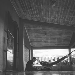 Silhouette man on bridge