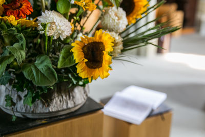 Sunflower bouquet in swiss church and bible