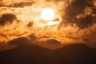 Low angle view of dramatic sky during sunset