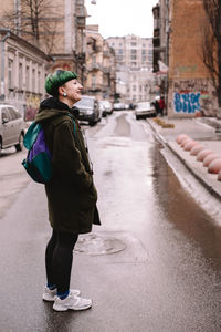 Full length of woman standing in city